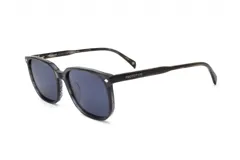 Lentes de sol de armazón cuadrado, color gris oscuro jaspeado, con lentes oscuros. En la patilla se lee la marca "PROTOTYPE" en blanco.