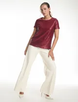 Blusa de lentejuelas color verde oscuro, marca Ninety, con escote a la base, manga corta y forro interno a tono.