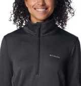 Buzo polar Columbia de mujer, color gris, con media cremallera frontal, cuello alto, mangas largas con orificios para pulgares y bolsillo con cremallera en la manga izquierda.