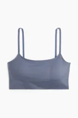 Bralette suave color azul con breteles ajustables y bajo ancho acanalado. Copas forradas con relleno extraíble. Sin cierre ni aros. Confeccionado con un mínimo de costuras para un ajuste cómodo.