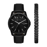 Set de reloj Armani Exchange con caja y pulsera de acero inoxidable color negro. El reloj tiene correa de cuero negra y esfera negra con el logo de la marca. Incluye una pulsera de eslabones gruesos también en color negro.