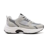 Championes deportivos American Sport Joggy color beige con detalles en dorado y suela gruesa.