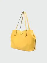 Cartera tote Longchamp modelo Roseau Essential, de cuero color celeste, con cierre de broche metálico y doble asa de hombro.