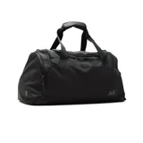 Bolso deportivo tipo duffel bag color negro, con asas de mano y correa ajustable para llevar al hombro. Presenta un pequeño logo con las letras "AS" en la parte frontal.