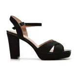 Sandalias negras de vestir con plataforma y tacón bloque alto. Presentan tiras cruzadas con glitter y pulsera al tobillo con hebilla.