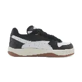 Championes Puma Park Luna de cuero sintético blanco y negro con suela marrón.