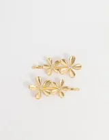 Set de dos horquillas doradas con apliques de flores y detalle de strass en el centro.