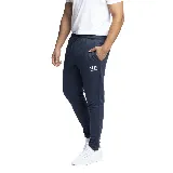Pantalón de jogging azul marino con cintura elástica ajustable con cordón, bolsillos laterales y logo de Umbro estampado en blanco en la pierna izquierda.