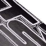 Pantalón de jean negro con efecto lavado y estampado de estrella con strass en la pierna derecha.