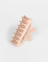 Broche para el pelo color rosa claro, con forma de pinza y diseño de moño.