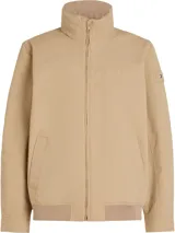 Campera color beige de Tommy Hilfiger, con cuello alto y cierre de cremallera. Tiene dos bolsillos laterales y logo engomado de Tommy Hilfiger bordado en la manga.