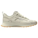 Championes Under Armour Street Mirage color beige con suela color naranja.