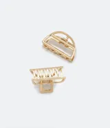 Set de dos pinzas para el pelo doradas, una con forma de semicírculo y otra rectangular con dientes. Fabricadas en metal.