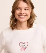 Conjunto de pijama largo confeccionado en fleece, compuesto por una blusa de manga larga con bordado de gatito comiendo pizza y un pantalón con cintura elástica y estampado de lunares.