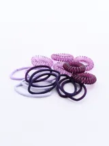 Pack de 16 coleros de pelo, con diseños variados en tonos lila y morado. Incluye coleros de tela y coleros de plástico en espiral.