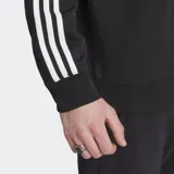 Buzo Adidas Adicolor Classic negro con cuello redondo y mangas largas con tres rayas blancas. Logo del trifolio bordado en el pecho.