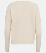 Buzo amarillo de algodón de punto, manga larga y sisa desplazada.