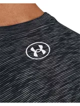 Remera deportiva Under Armour Tech™ para hombre, color negro jaspeado, de corte suelto y tejido ligero y transpirable. Cuenta con logo de la marca en el pecho.