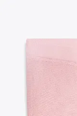 Falda midi de punto color rosa, con cintura elástica.