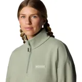 Buzo Columbia para mujer, color verde salvia, con media cremallera frontal, cuello alto, corte holgado, puños y cintura elastizados, y logo de la marca bordado en el pecho. Confeccionado en felpa francesa.