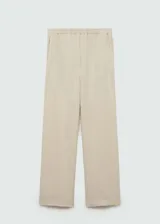 Pantalón largo color crema de bambula, corte wide leg y cintura elástica.