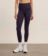 Calza legging deportiva color azul oscuro, de poliamida, con cintura alta y sin estampa.