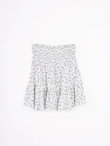 Minifalda con estampado geométrico en blanco y azul marino.