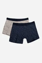 Pack de dos bóxers estampados, uno con diseño geométrico en tonos marrones y cintura elástica negra, y otro con estampado floral en tonos azules y cintura elástica gris.