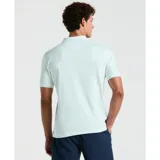 Polo celeste de tejido interlock, diseño liso con el logo Sticker Pete bordado al pecho, cuello clásico y tapeta con botones.