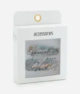 Set de dos pinzas para el pelo con efecto abulón en tonos beige, celeste y lila. El clip es dorado.