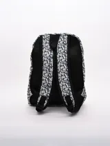 Mochila con estampado botánico en tonos azul marino y blanco, con dos compartimentos frontales con cierre y tiradores de cremallera trenzados.