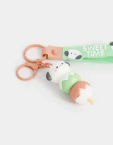 Llavero con dije de perrito apilado como helado, con strap de silicona verde con texto "Sweet Time" y mosquetón metálico.