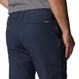 Pantalón de hombre color azul marino, de corte recto, con bolsillos laterales, bolsillos de seguridad con cierre y bolsillo para cuchillo. Confeccionado en tejido elástico con tecnología Omni-Shade UPF 50.