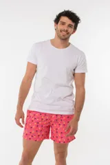 Short de baño azul con estampado de hojas de palmera en tonos azules, blancos y rosados.