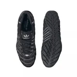 Zapatillas Adidas Adi Racer Low color negro con detalles plateados y diseño acolchado.