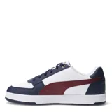 Championes Puma Caven 2.0 blancos con detalles en negro y dorado, con cordones y logo de la marca en el lateral.