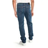 Jeans de hombre color azul medio lavado, corte slim a través de la pierna, con cierre de cremallera y botón con logo CAT. Presenta diseño de cinco bolsillos con remaches y parches con logo CAT.