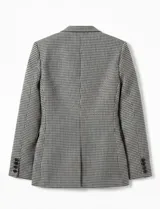 Blazer de mujer con estampado pata de gallo (tejido gales) en blanco y negro, de corte estructurado con solapas y cierre frontal de un botón.