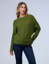 Buzo de tejido acanalado color mostaza, con mangas largas tipo dolman y corte holgado, de la marca Ninety.