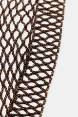 Diadema elástica color dorado con aplicación de abalorios y brillos combinados a tono.