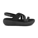 Sandalias negras de cuero Usaflex con plataforma, tiras cruzadas y ajuste con velcro.