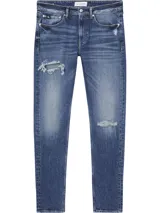 Jeans de corte slim tapered, de algodón reciclado, con rotos en las piernas y bragueta con cremallera.