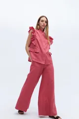 Pantalón palazzo color crudo, confeccionado en lino 100%.