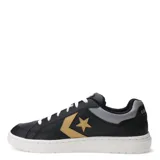 Championes unisex en color negro con detalles en dorado, con cierre de cordones y diseño urbano.
