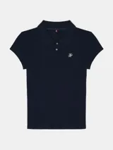 Chomba Tommy Hilfiger azul marino de piqué, corte slim, cuello tipo polo, cartera de dos botones, manga corta y logo bordado en el pecho.