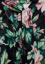 Blusa de gasa con estampado floral, cuello alto, manga larga con volantes y cierre de lazo en la parte posterior.