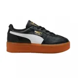 Championes Puma Palermo Elevata de cuero color negro con franja blanca y suela marrón.