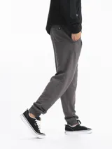 Pantalón de jogging de felpa color gris oscuro melange, con puños ajustados en los tobillos y cordón de ajuste en la cintura.