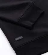 Buzo deportivo color verde claro, de manga larga y cuello redondo. Confeccionado en tejido de poliéster, viscosa y elastano.