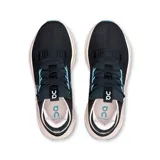 Championes negros de la marca On Running, modelo Cloudnova 2, con detalles en celeste y suela color crema.